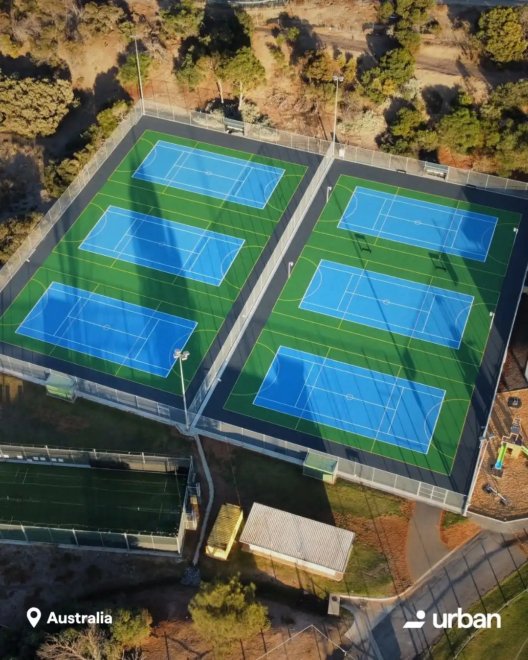 Aerial view of a multi-court Greenset tennis and padel facility